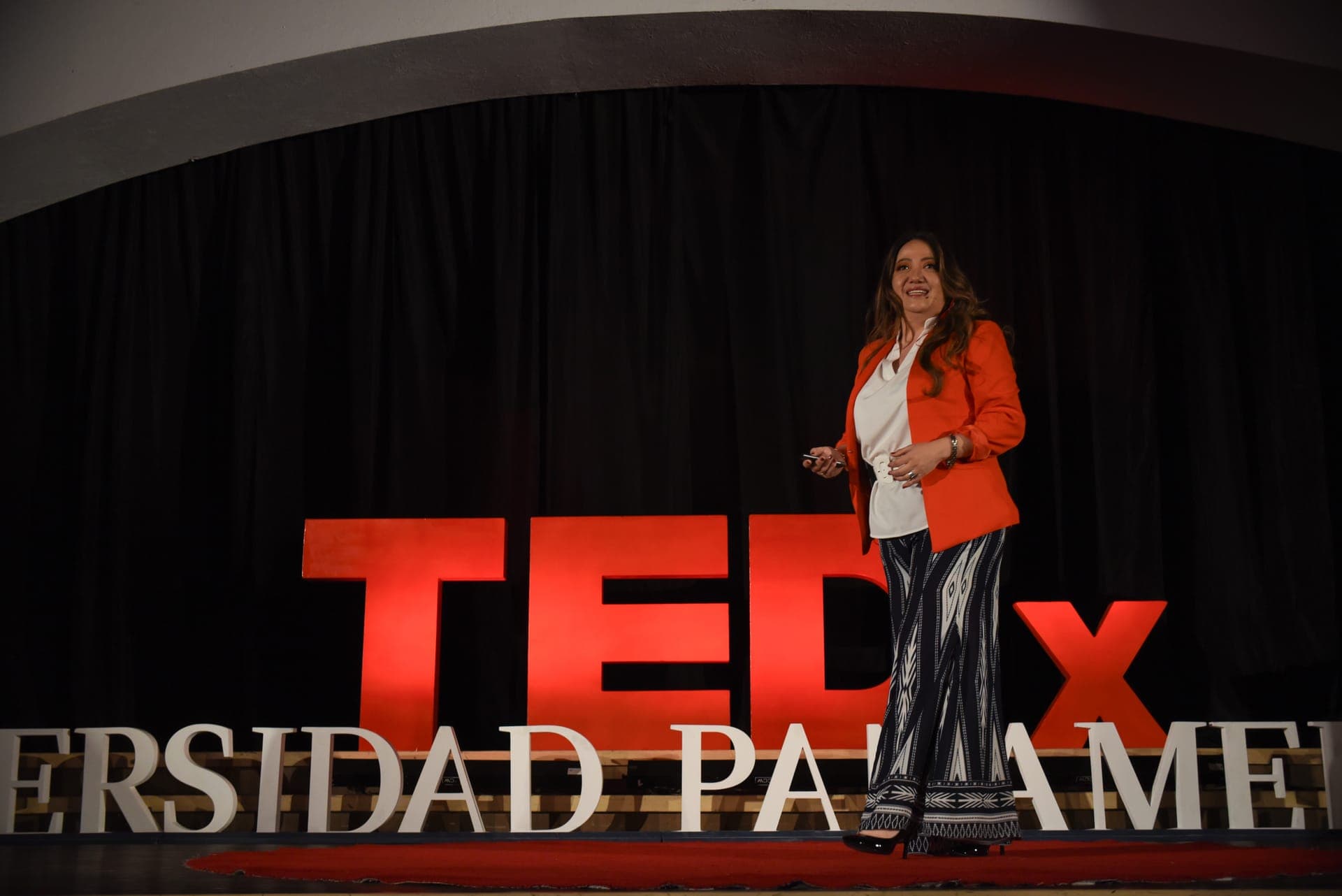 Minué Yoshida delivering a keynote on stage