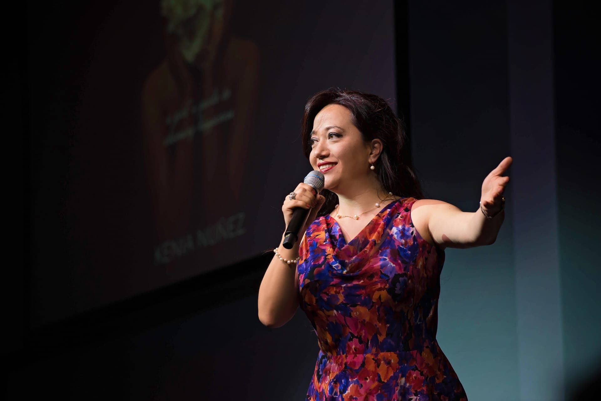 Minué delivering a keynote presentation